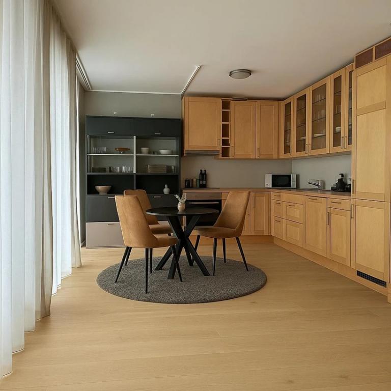 ILLUSTRASJON av stue/kjøkken etter gulvbytte.